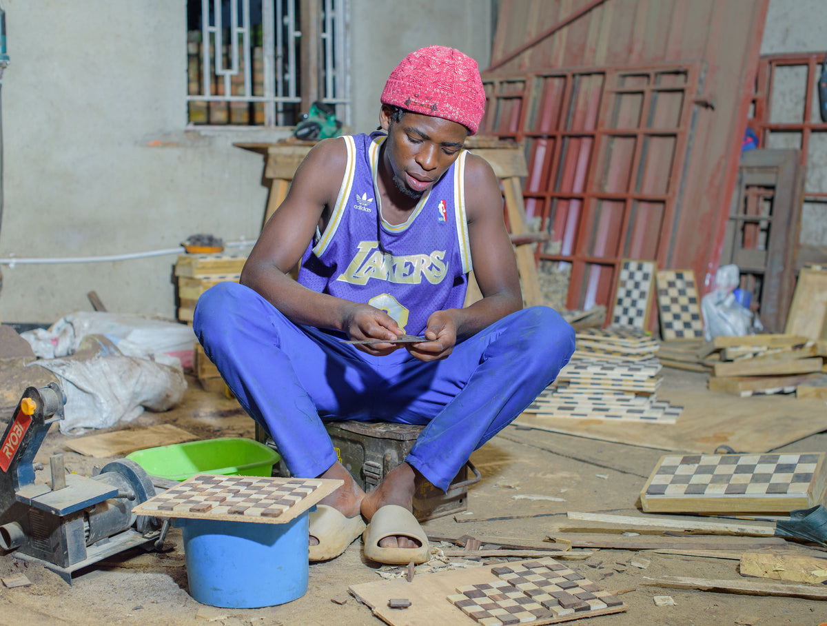 Things From Africa artisan at work on handmade African decor
