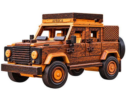 Handcrafted wooden African safari 4×4 viewed from the front left, with a roof rack, detailed grille, wooden wheel hubs and a rear spare wheel.