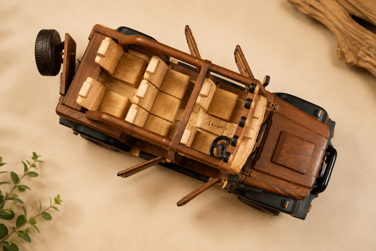Top view of handmade wooden safari Jeep ornament showing handcrafted seats and interior details